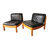 Pair of designer leather armchairs 80s