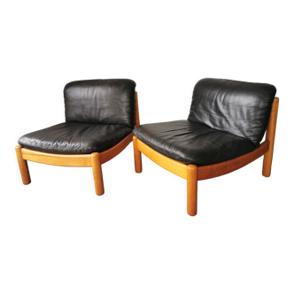 Pair of designer leather armchairs 80s
