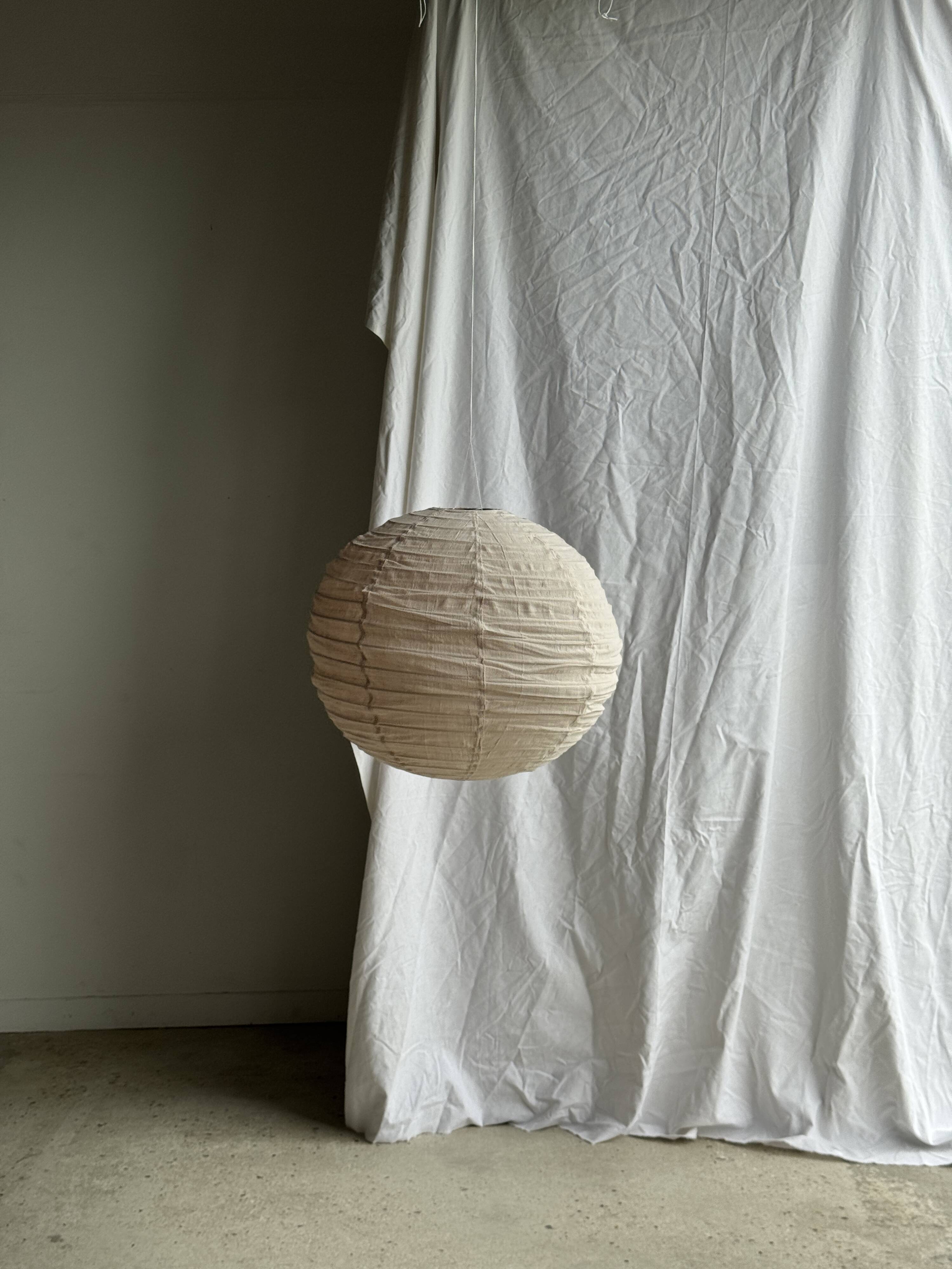 Large round pink Japanese-style suspension made of rattan and natural linen D60.