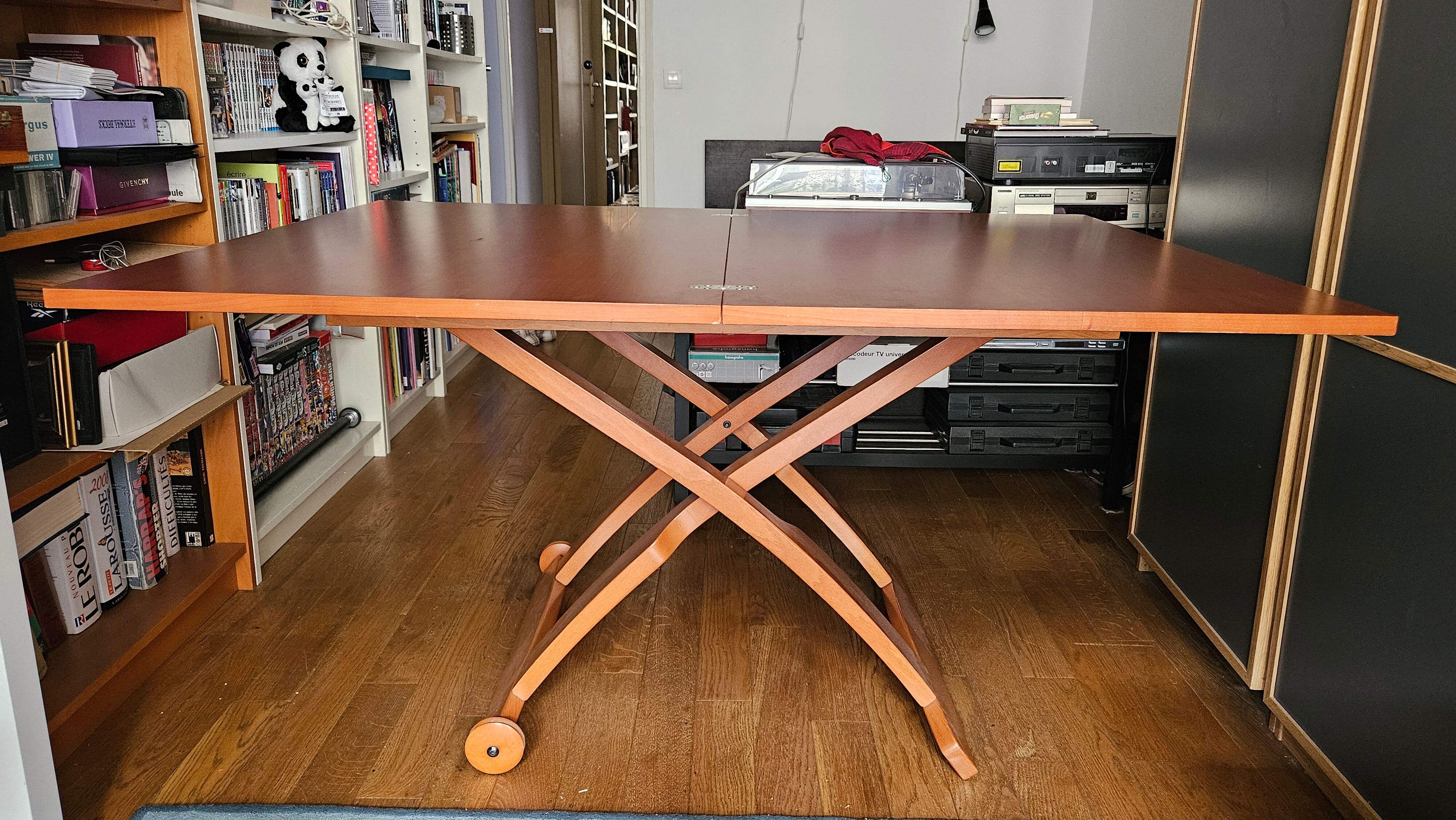 Wooden coffee table convertible into a dining table.