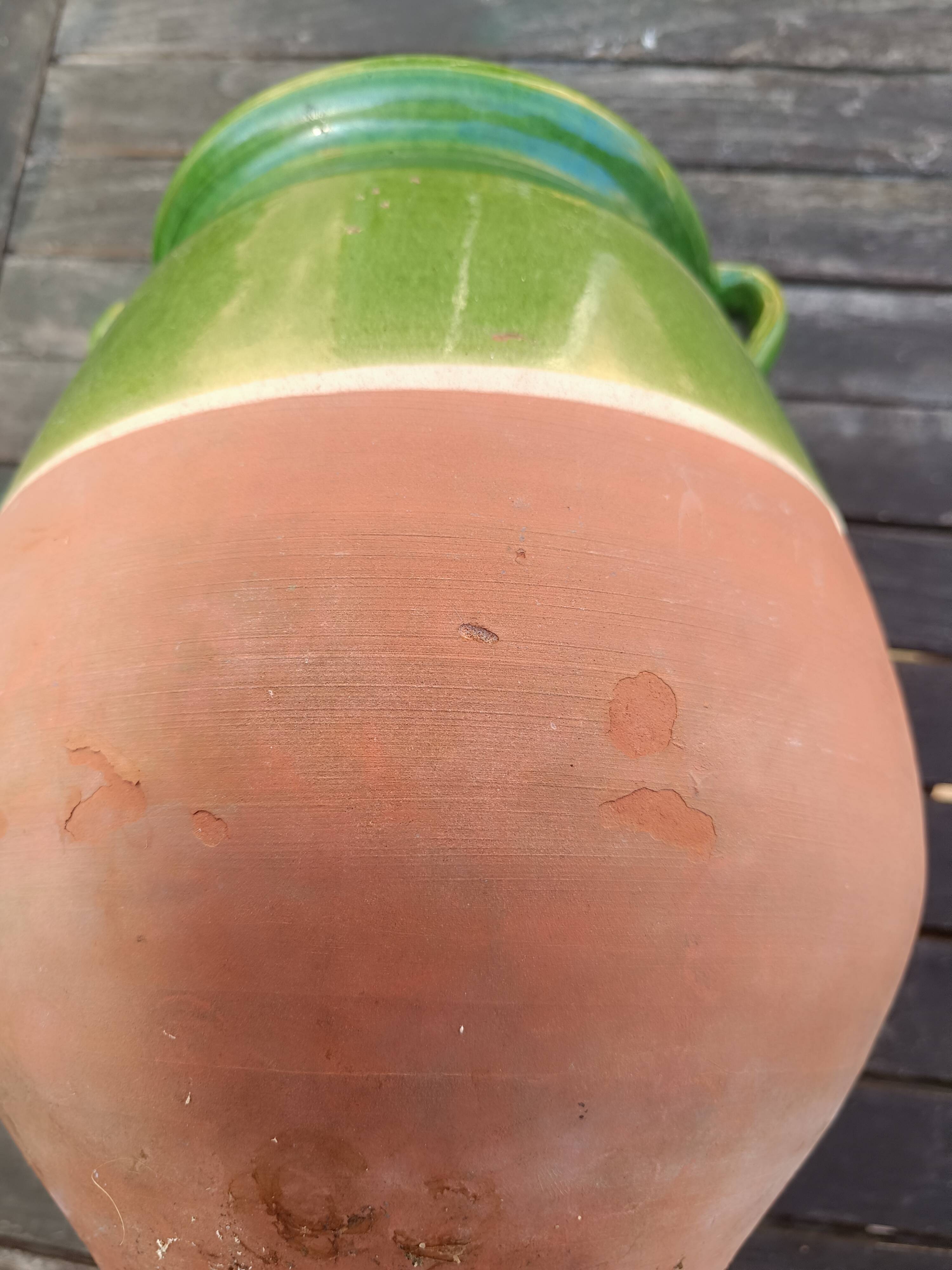 Mediterranean pot in green half-glazed terracotta.