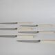 set of 6 small white bakelite knives 1960