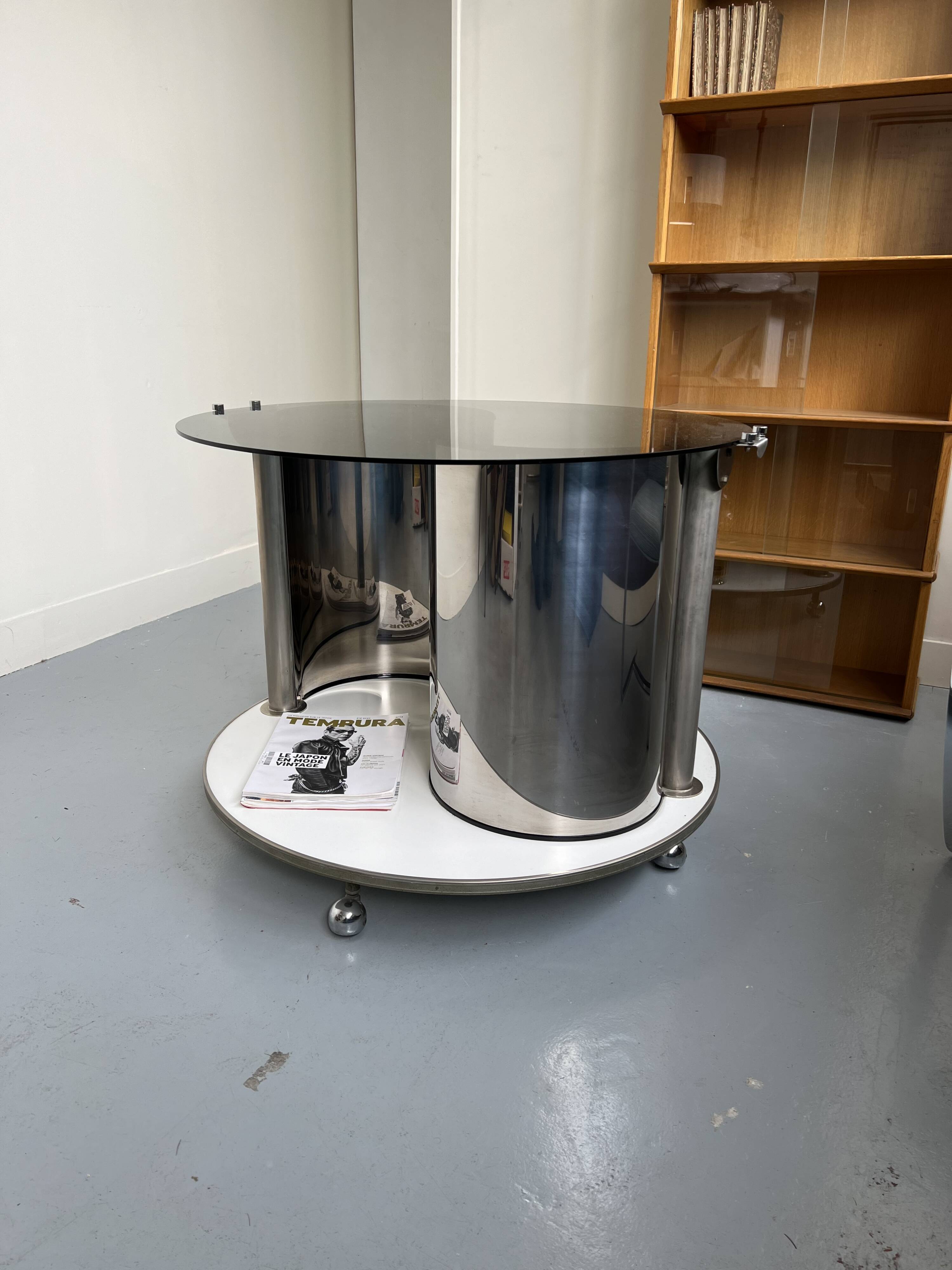 Vintage metal and smoked glass coffee table on casters bar