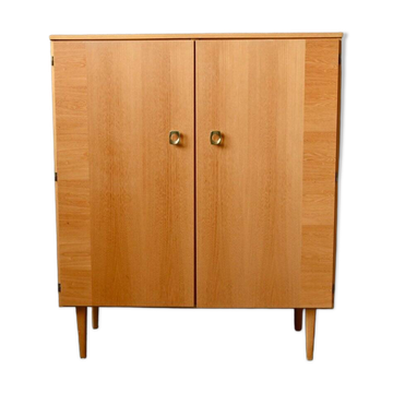 Vintage 1960s shoe cabinet in light wood and chrome metal.