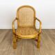 Child's armchair in rattan and caning from the 1960s.