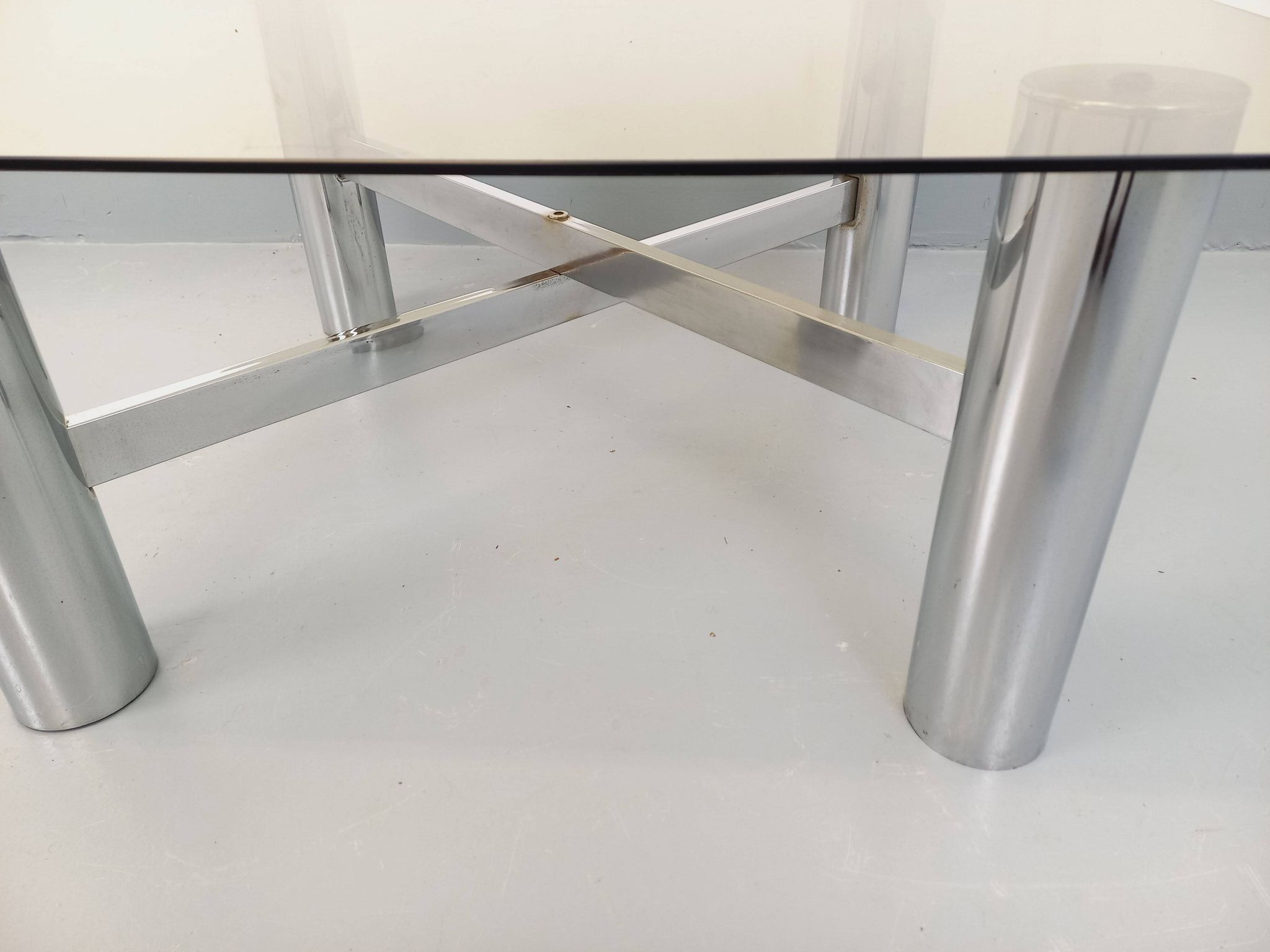Square Italian vintage Space Age coffee table in smoked glass and metal.