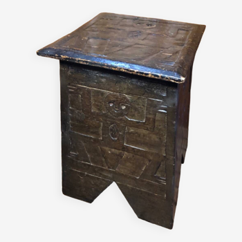 Old stool with vintage carved wood chest