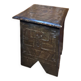 Old stool with vintage carved wood chest