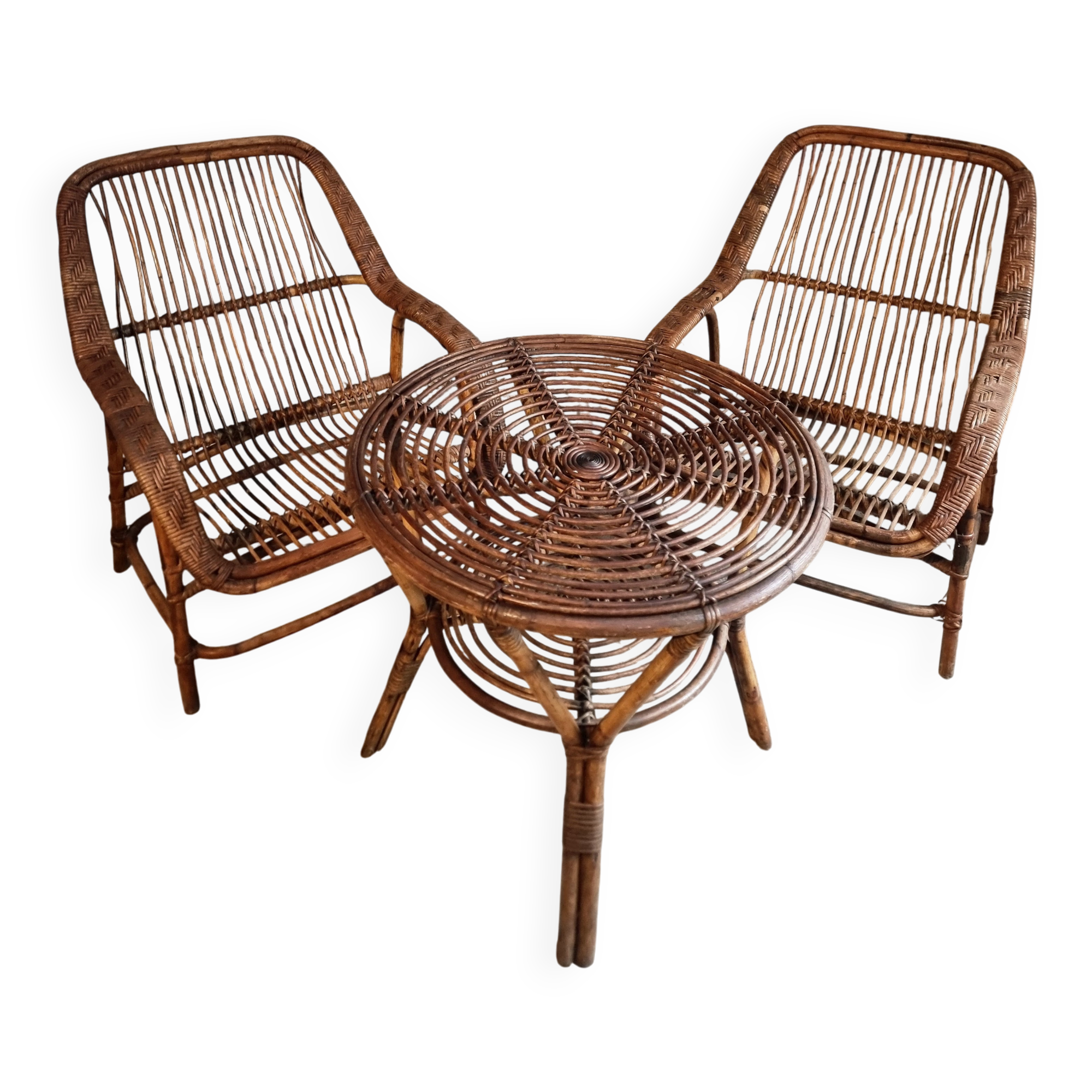 Vintage rattan lounge set, French wicker armchairs and round table, circa 1930–1950.