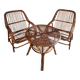 Vintage rattan lounge set, French wicker armchairs and round table, circa 1930–1950.