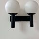 Vintage double wall lamp, opaline and black lacquered metal, Raak Netherlands 1960