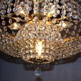 Antique castle style chandelier with tassels and floral details