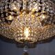 Antique castle style chandelier with tassels and floral details