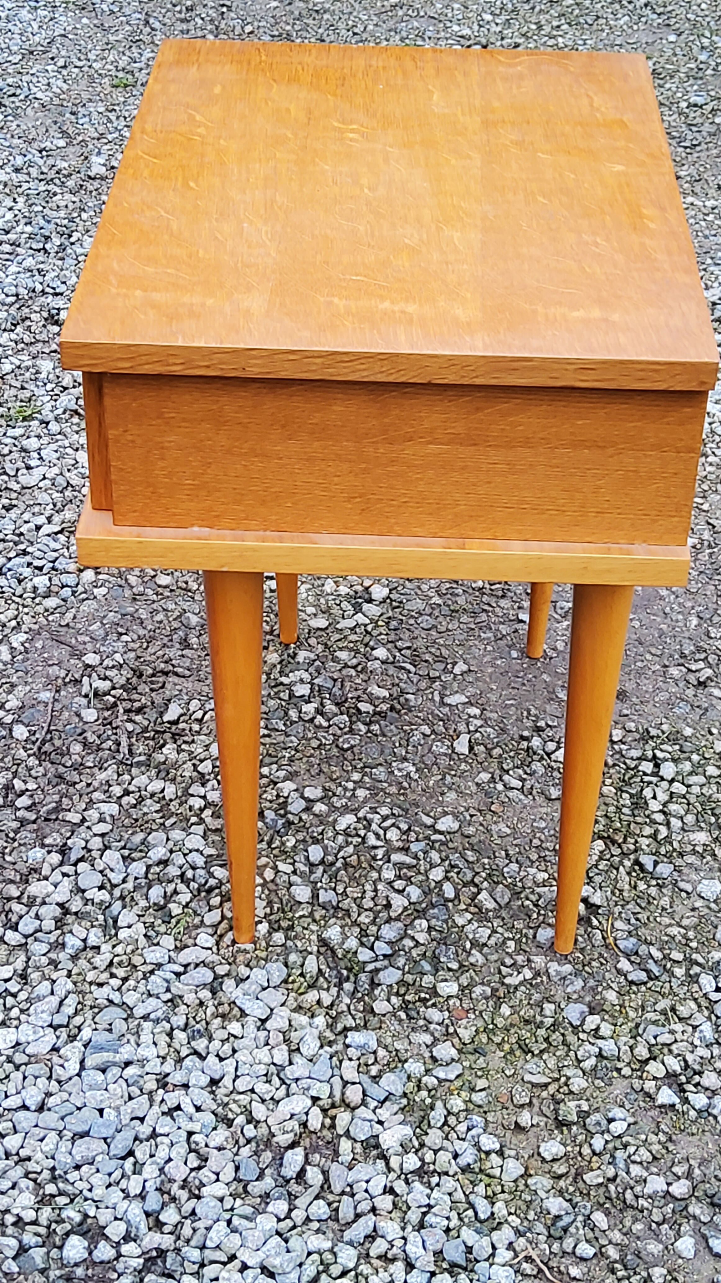 Vintage bedside table in golden blond oak conical feet from the 60s