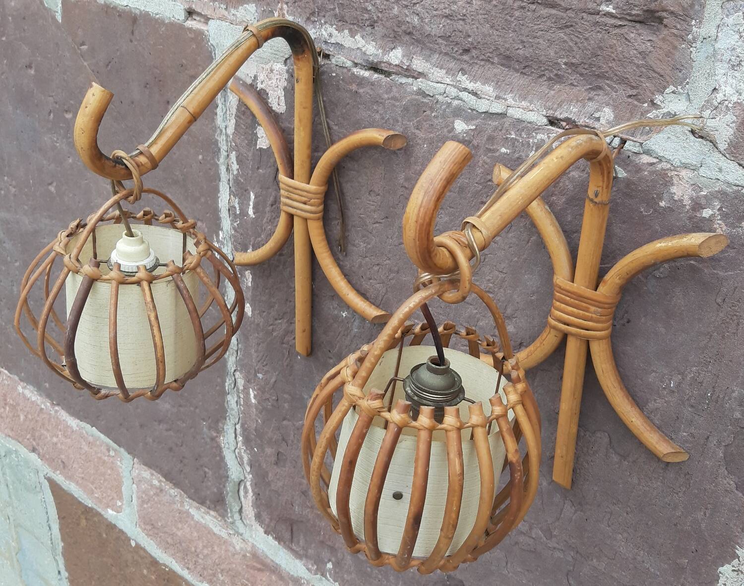 Pair of Louis Sognot rattan wall lights.