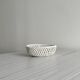 Small twisted porcelain bowl