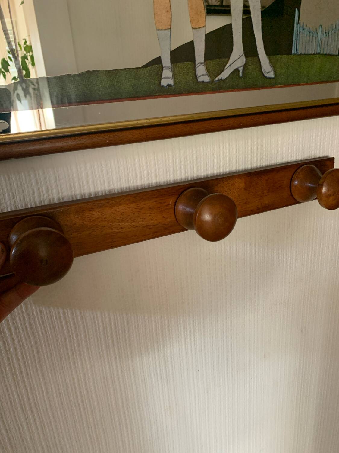 Wooden wall-mounted coat rack