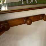 Wooden wall-mounted coat rack