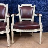Pair of Louis XVI cabriolet armchairs in lacquered wood and leather circa 1850