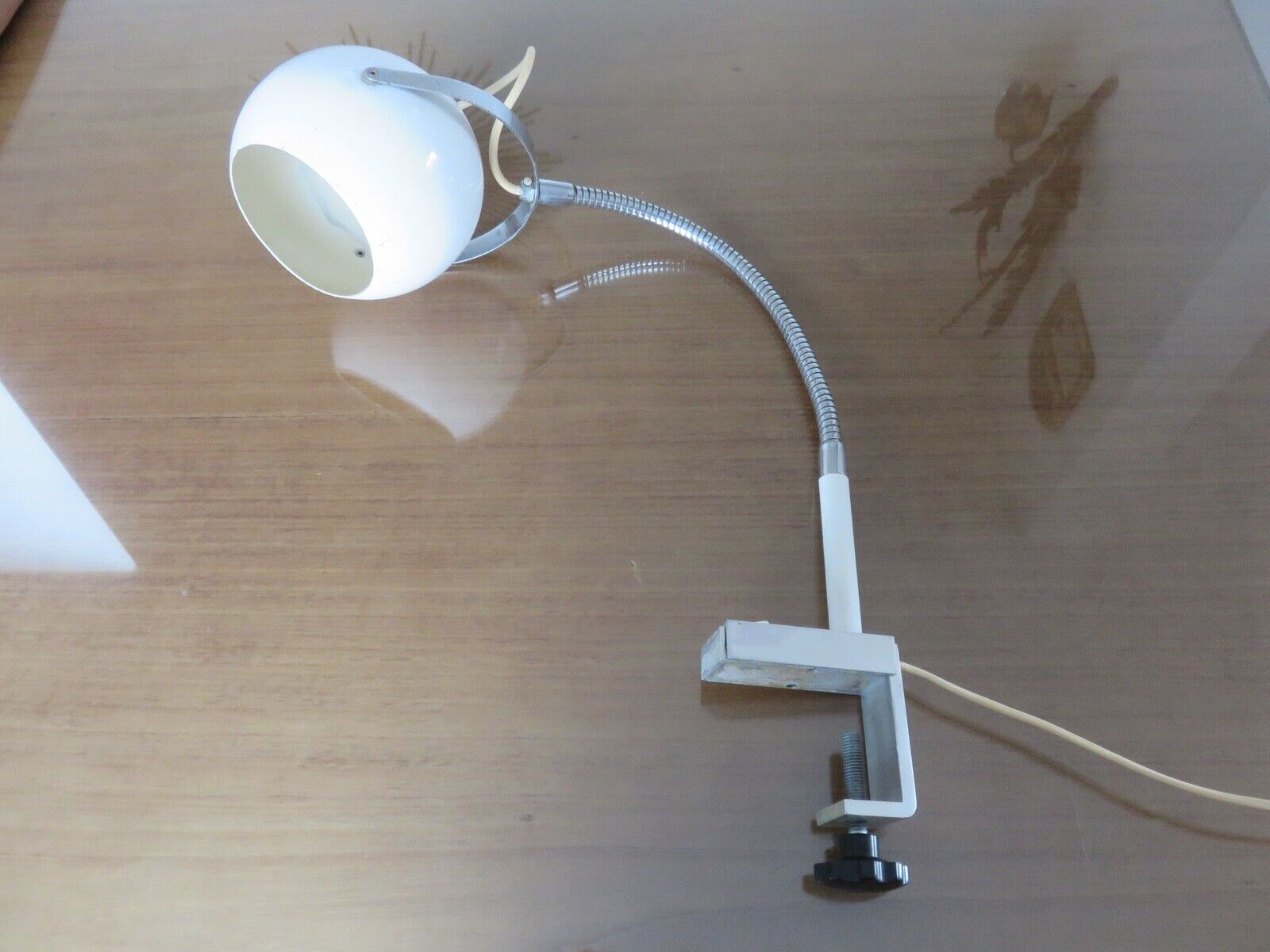 Eye ball lamp stapled on a chrome hose 70s