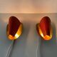 Pair of orange plexiglass and curved brass wall lights, 1950s, Germany