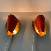 Pair of orange plexiglass and curved brass wall lights, 1950s, Germany