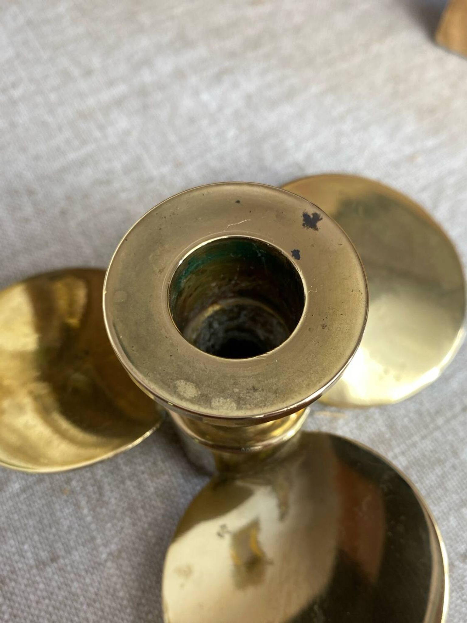 Pair of vintage brass propeller-shaped candlesticks