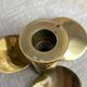 Pair of vintage brass propeller-shaped candlesticks