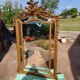 Large closed mirror, 19th century, wood and gilded stucco.