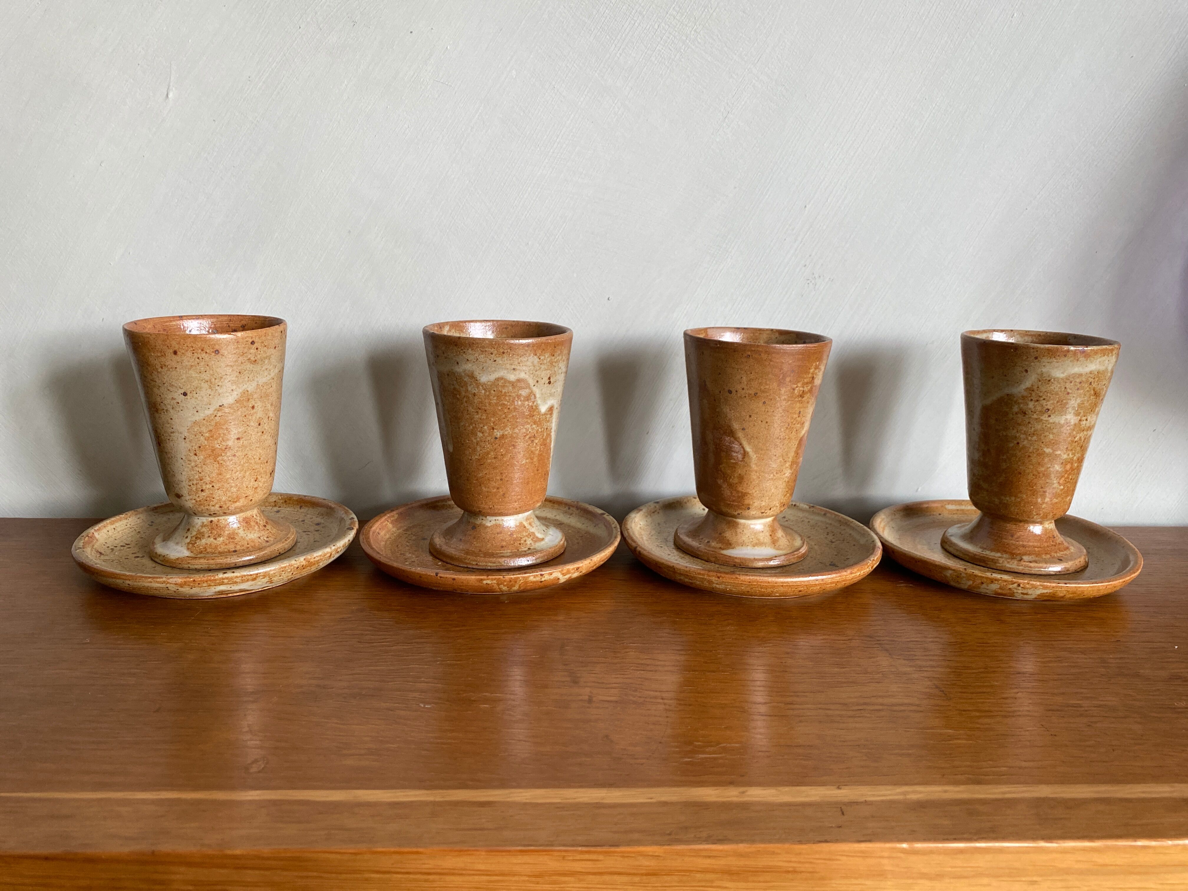 Set of 4 vintage stoneware coffee cups and plates