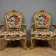 Pair of carved and gilded cabriolet armchairs in the Louis XV style.