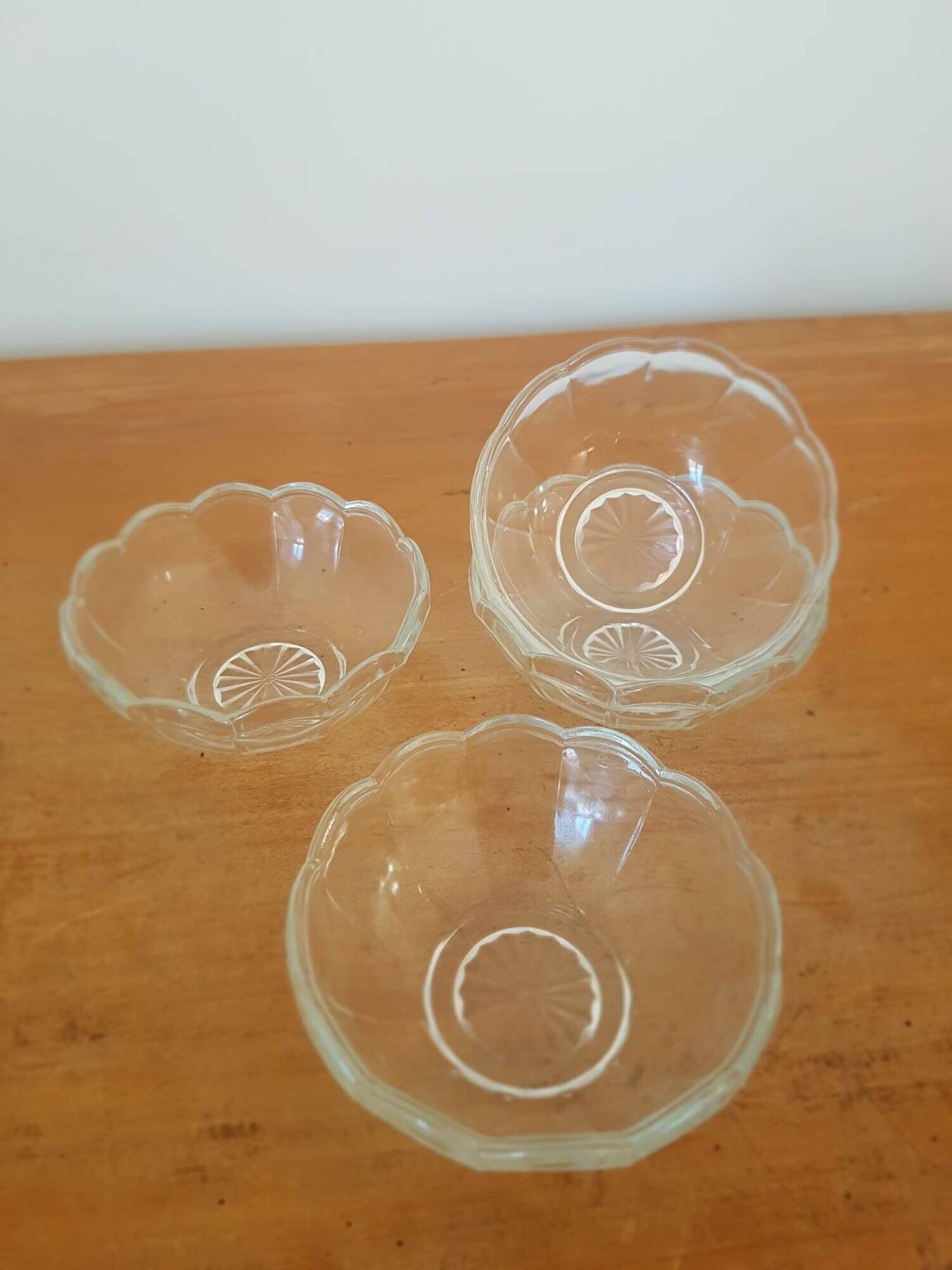 Set of 12 vintage scalloped glass dessert bowls.