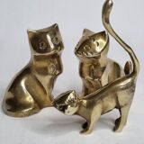 Set of three brass cats
