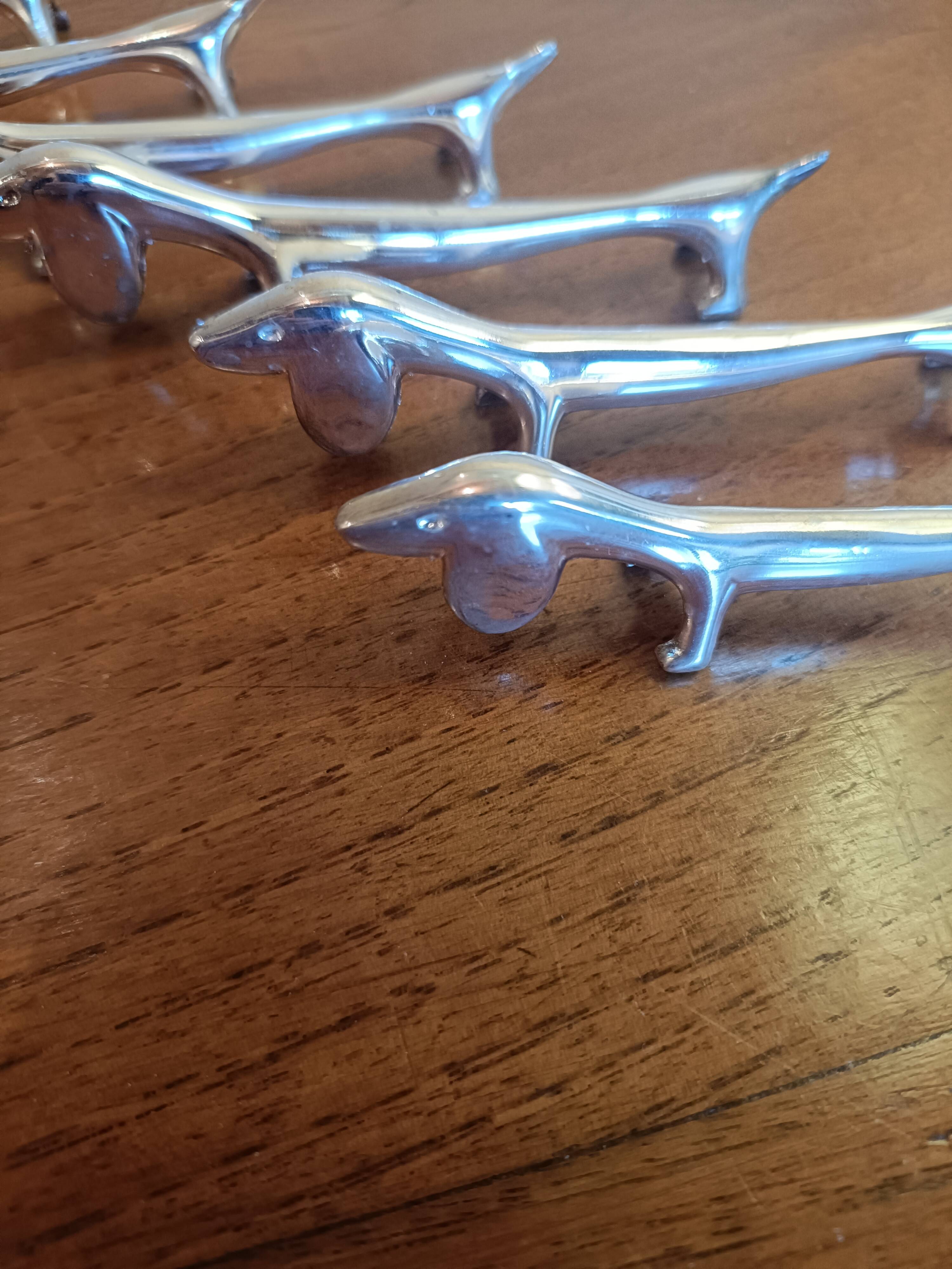 Six silver metal knife holders basset hound