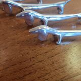 Six silver metal knife holders basset hound