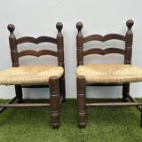 Pair of old low chairs in wood and straw