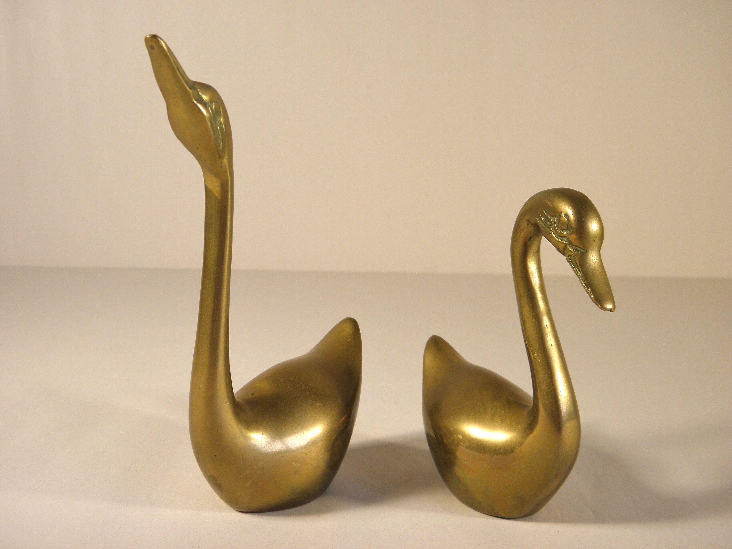 Pair of brass swans