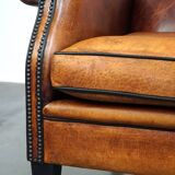 Sheepskin leather chair with a beautiful patina