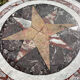 Round marble table with marble inlay