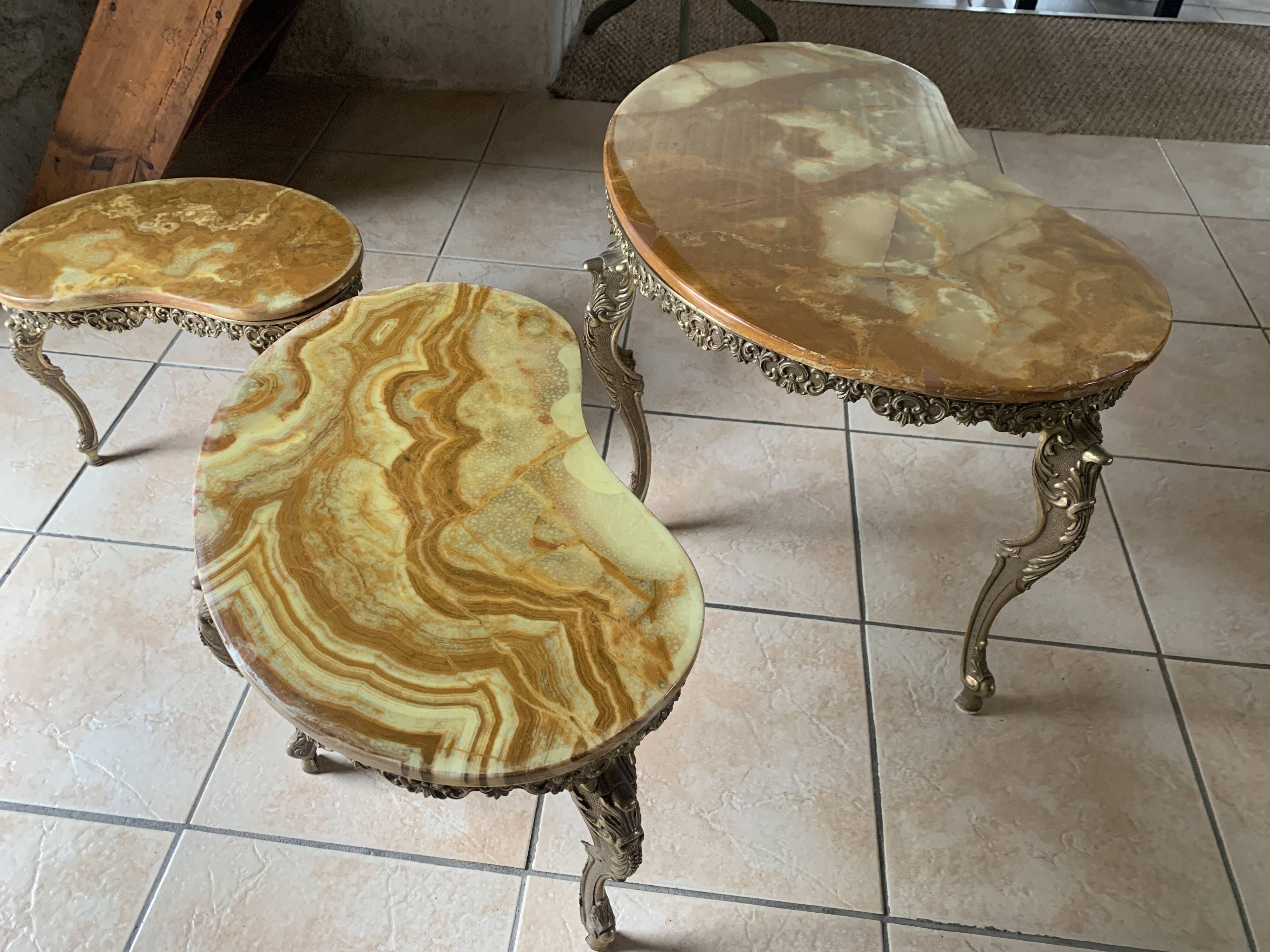 Lot of 3 marble and brass nesting tables.