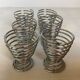 Six metal spiral egg cups