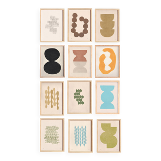 Collection of 12 framed paintings in warm/cool colours.