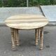 Round extendable dining table with flaps, stripped in raw oak, with 4 extensions.
