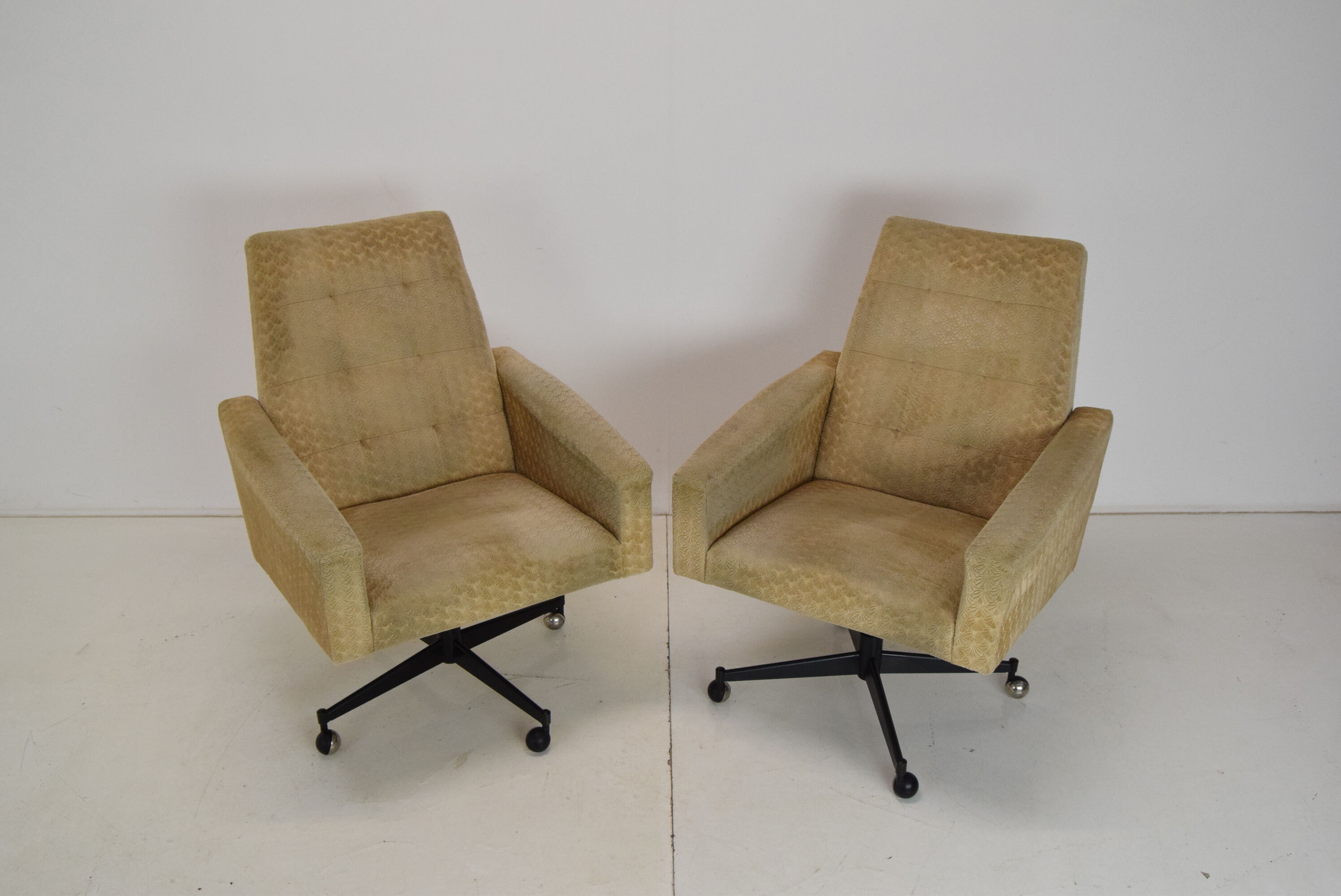 Pair of mid-century swivel armchairs with wheels 1970's
