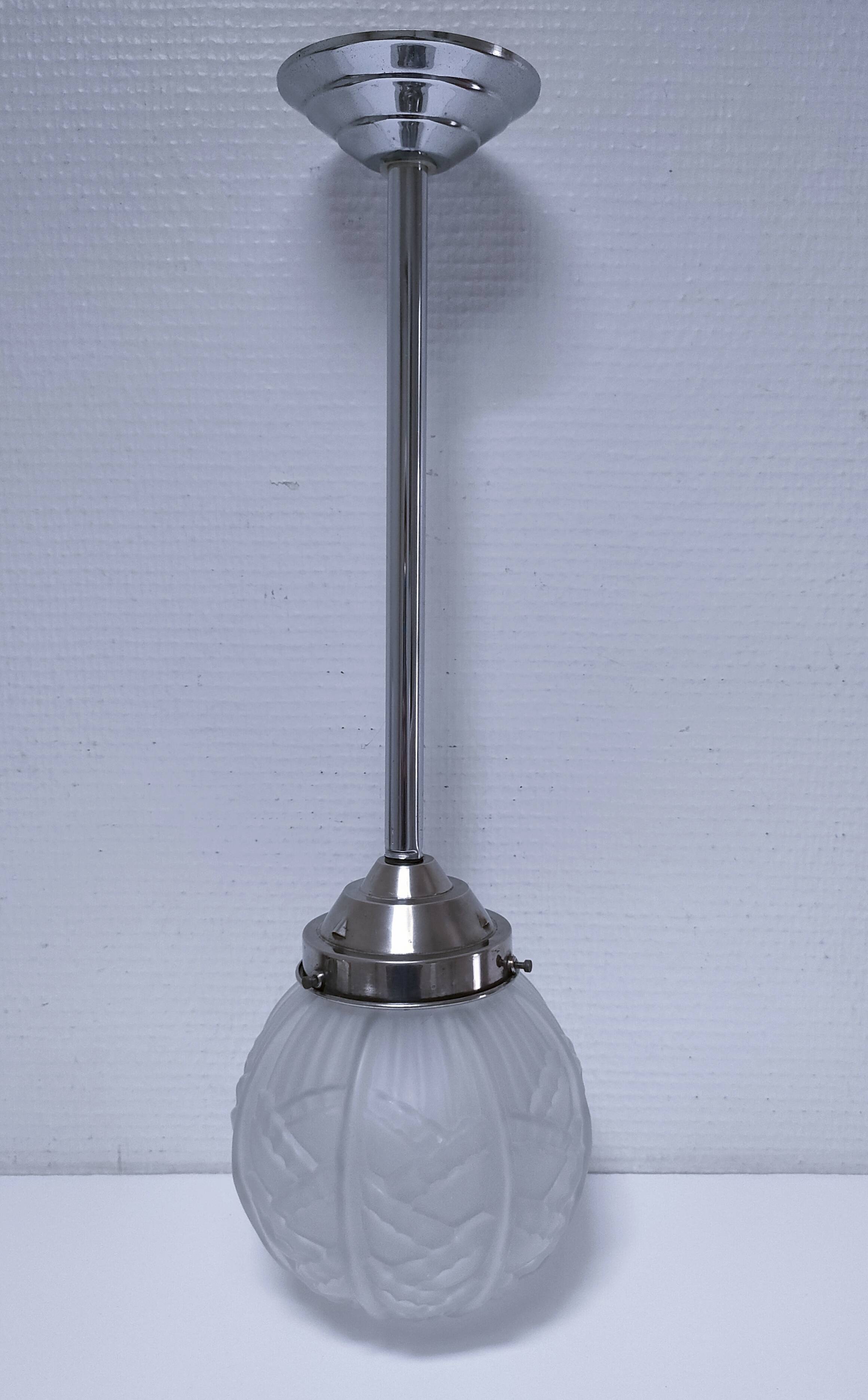 art deco pendant light with molded glass and chrome-plated metal frame