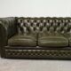 Three-seater green leather Chesterfield sofa