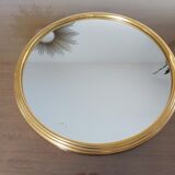 Round mirror tray in 1950s gold metal