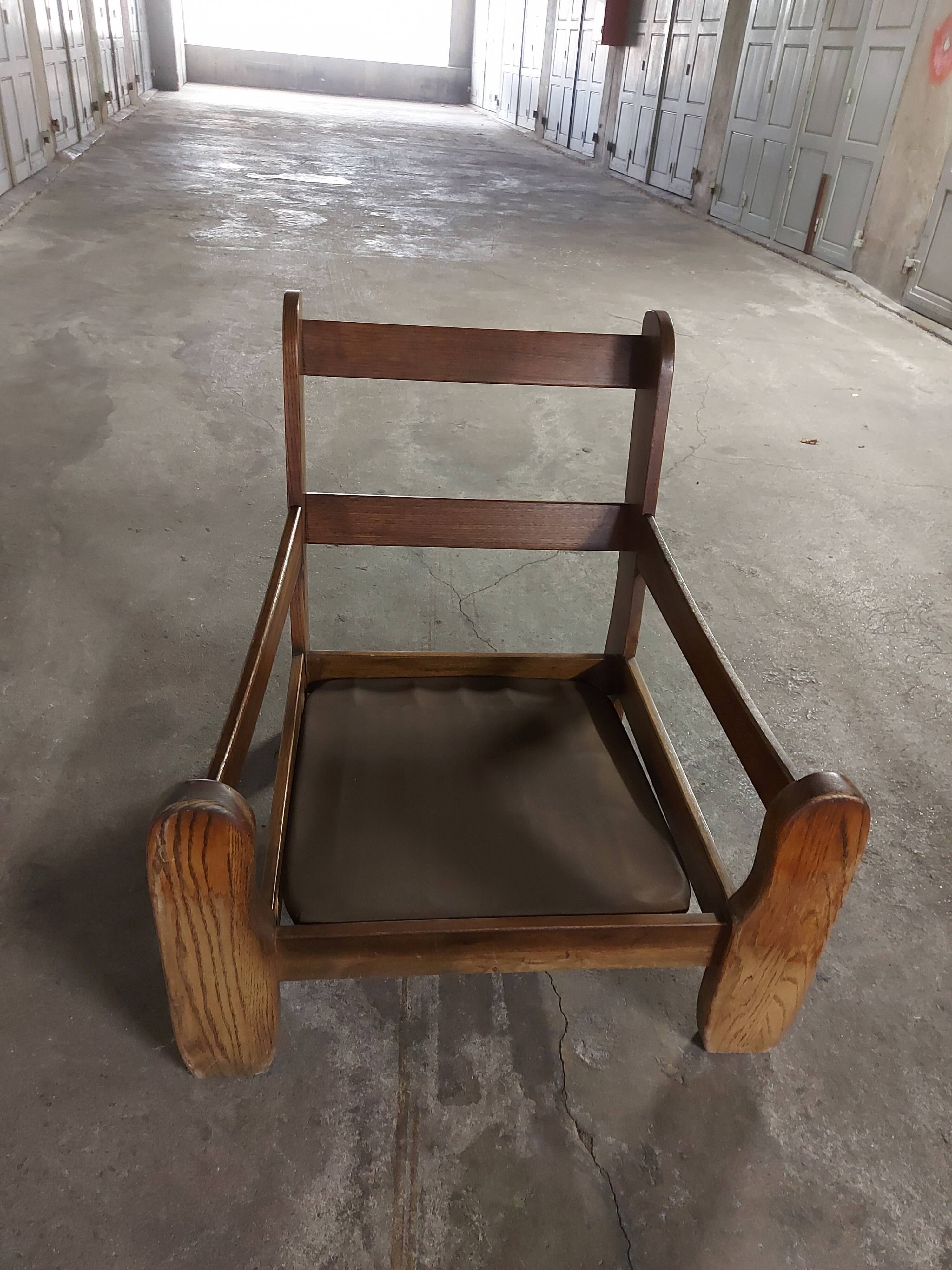 Armchairs in leather and vintage wood 70's