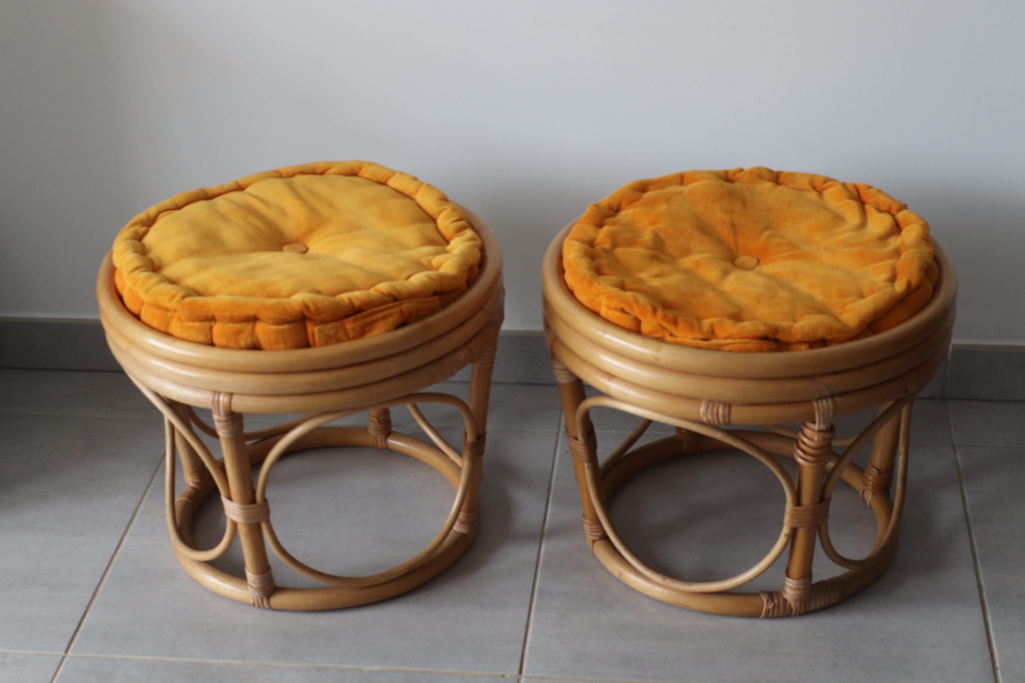 Two vintage rattan ottomans