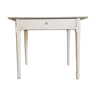 White and grey farmhouse table with its drawer